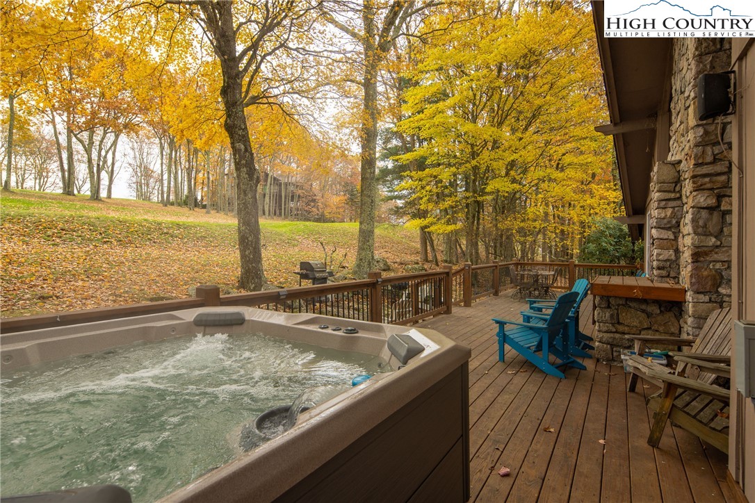 501 St Andrews Road Beech Mountain, NC 28604 - Photo 32 of 46 a view of a swimming pool with chairs