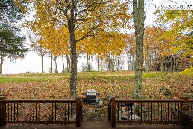 a view of two chairs in the patio