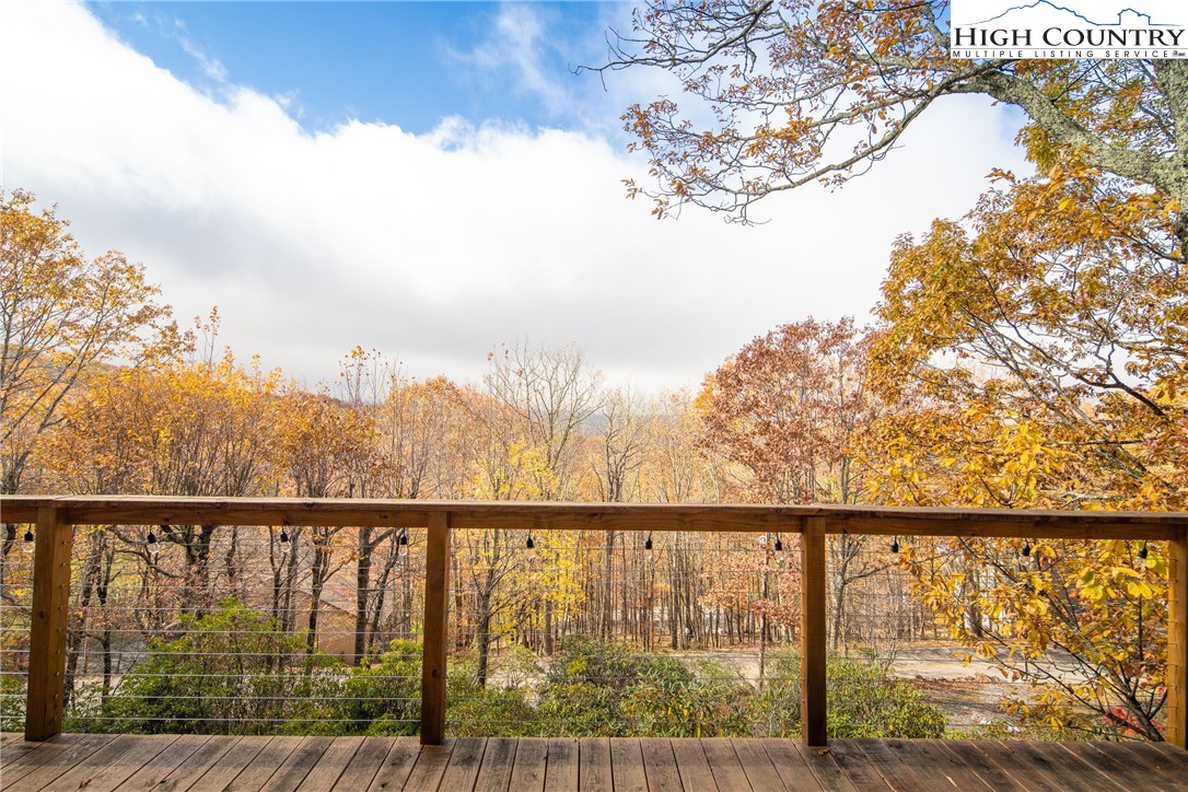501 St Andrews Road Beech Mountain, NC 28604 - Photo 39 of 46 a view of a balcony with wooden fence