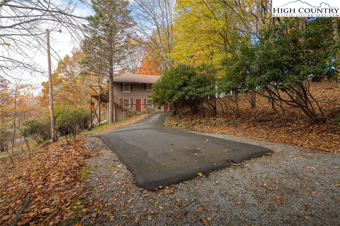 501 St Andrews Road Beech Mountain, NC 28604 - Photo 40 of 46 a view of a house with a yard
