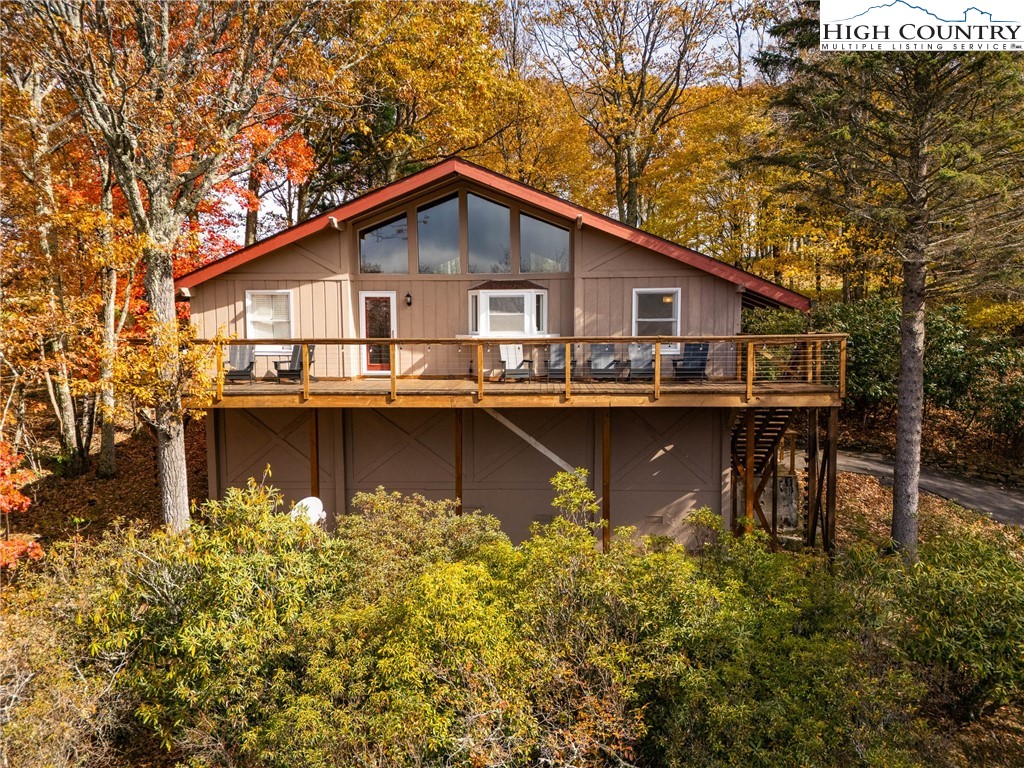 501 St Andrews Road Beech Mountain, NC 28604 - Photo 46 of 46 a front view of a house with garden