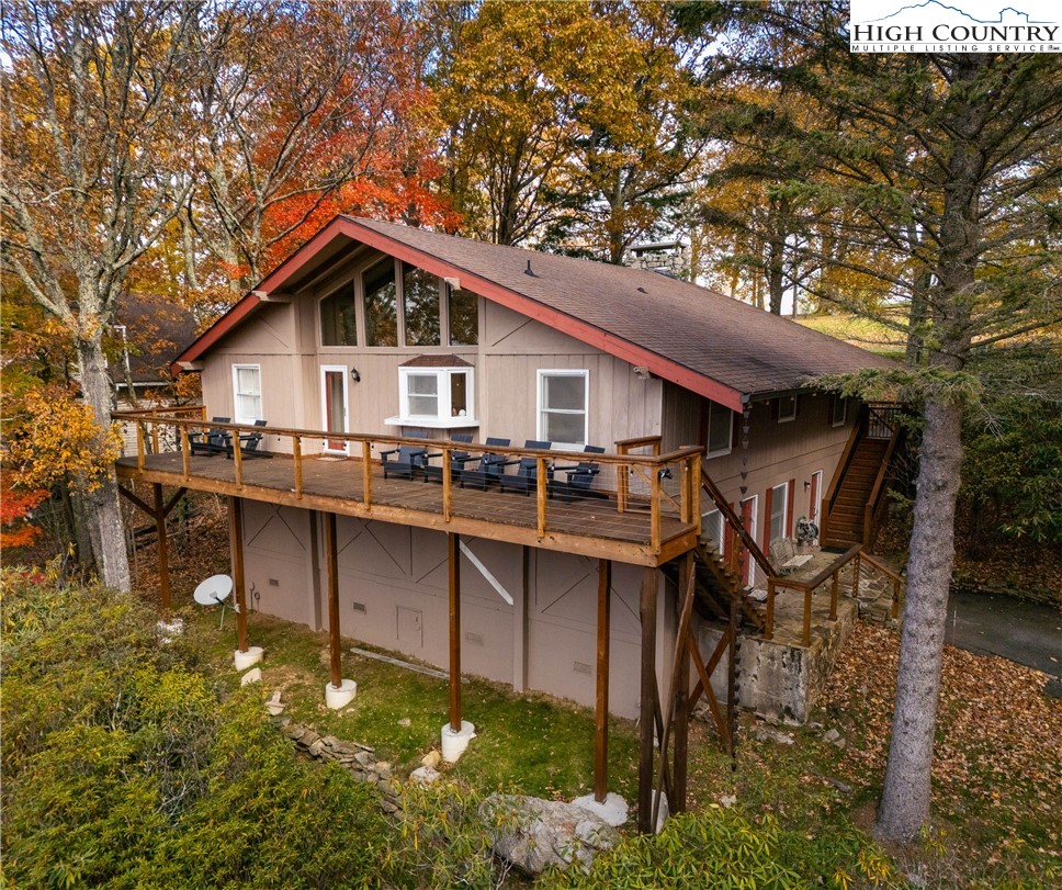 501 St Andrews Road Beech Mountain, NC 28604 - Photo 46 of 46 a view of a house with pool and chairs