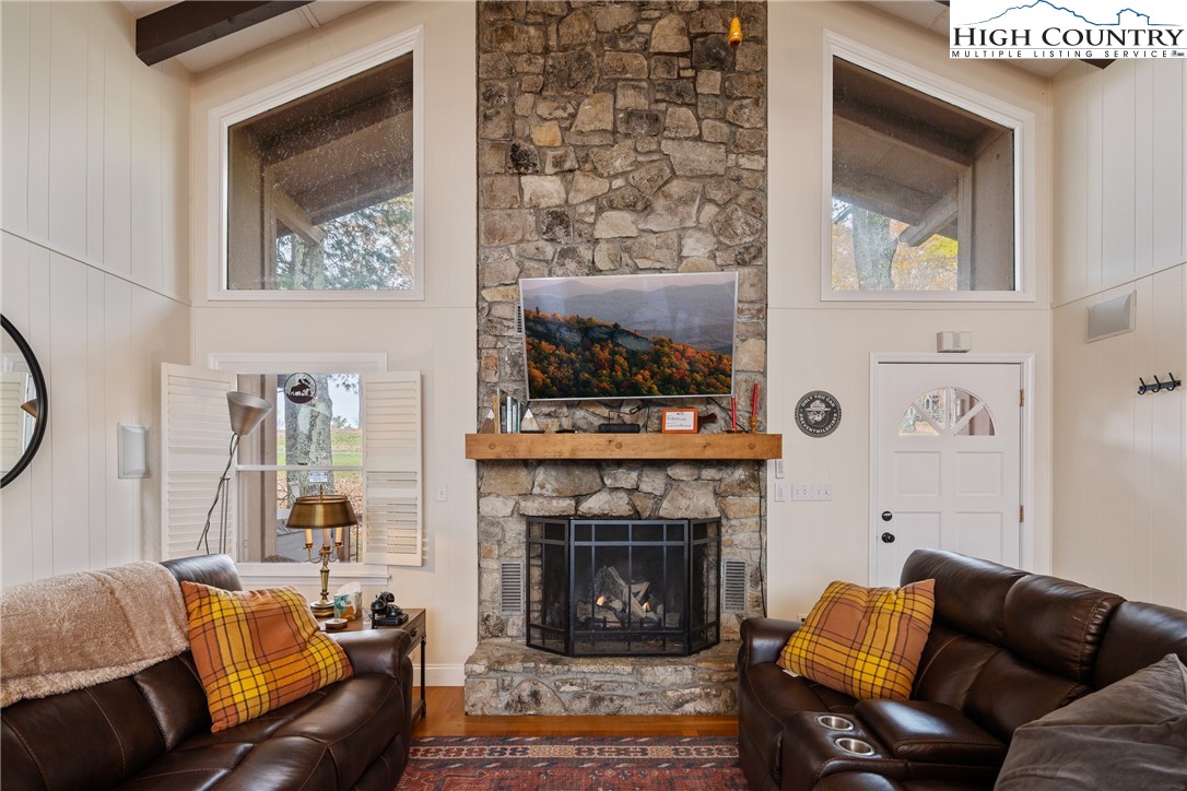 501 St Andrews Road Beech Mountain, NC 28604 - Photo 5 of 46 a living room with furniture and a fireplace