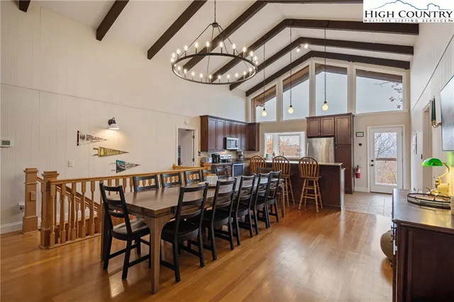 a bedroom with furniture and a wooden floor