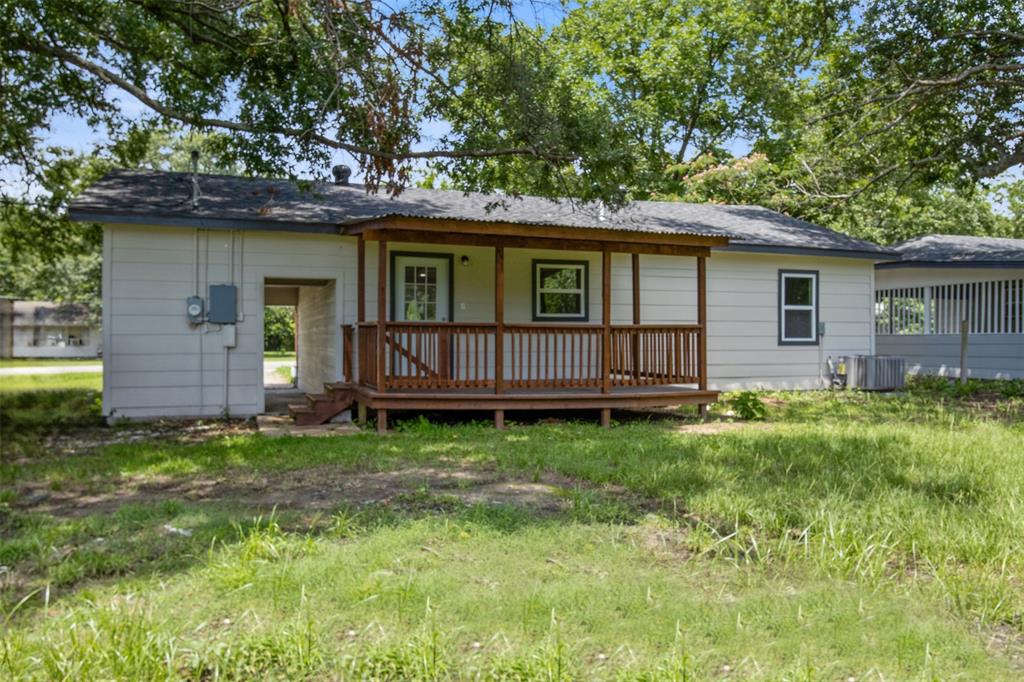 121 Circle Drive Bogata, TX 75417 - Photo 12 of 14 a view of backyard of house with wooden fence