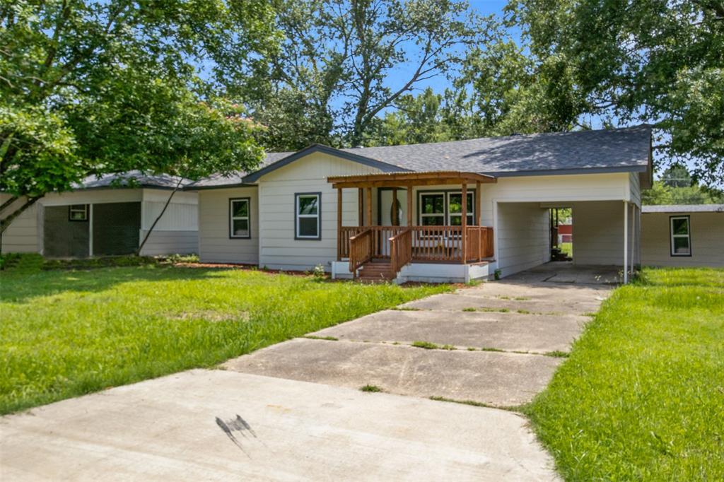 121 Circle Drive Bogata, TX 75417 - Photo 2 of 14 a view of a house with a yard