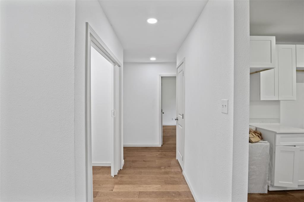 121 Circle Drive Bogata, TX 75417 - Photo 6 of 14 a view of a hallway with wooden floor