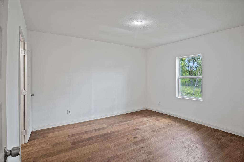 121 Circle Drive Bogata, TX 75417 - Photo 9 of 14 an empty room with a window