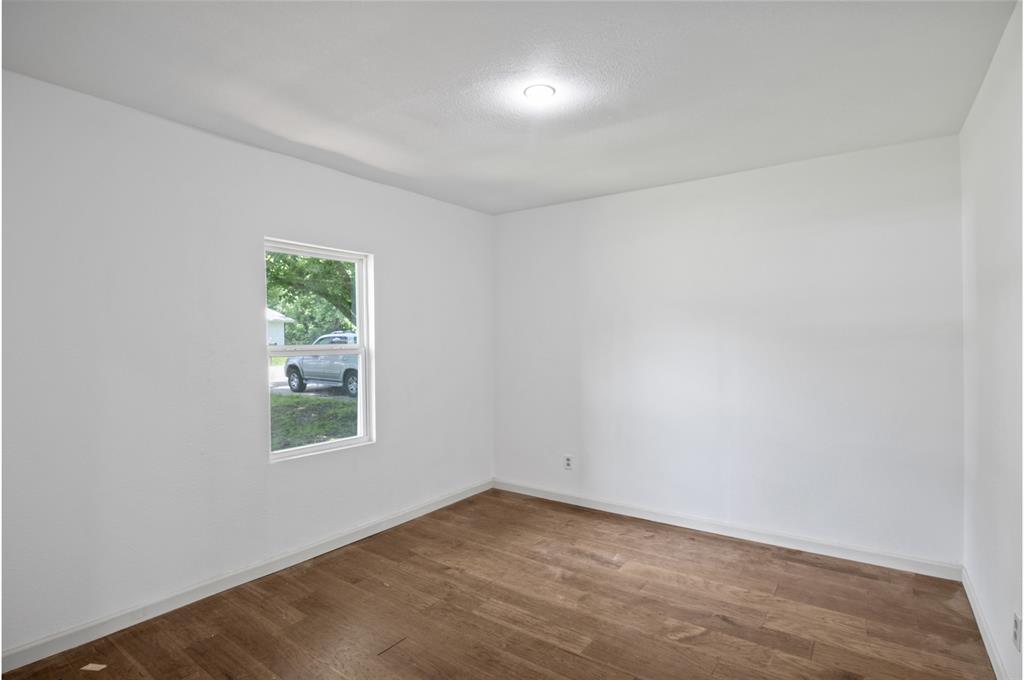 121 Circle Drive Bogata, TX 75417 - Photo 10 of 14 an empty room with windows