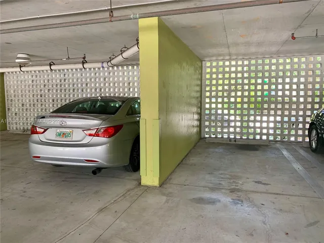 a view of a kitchen with a sink and a wooden floor