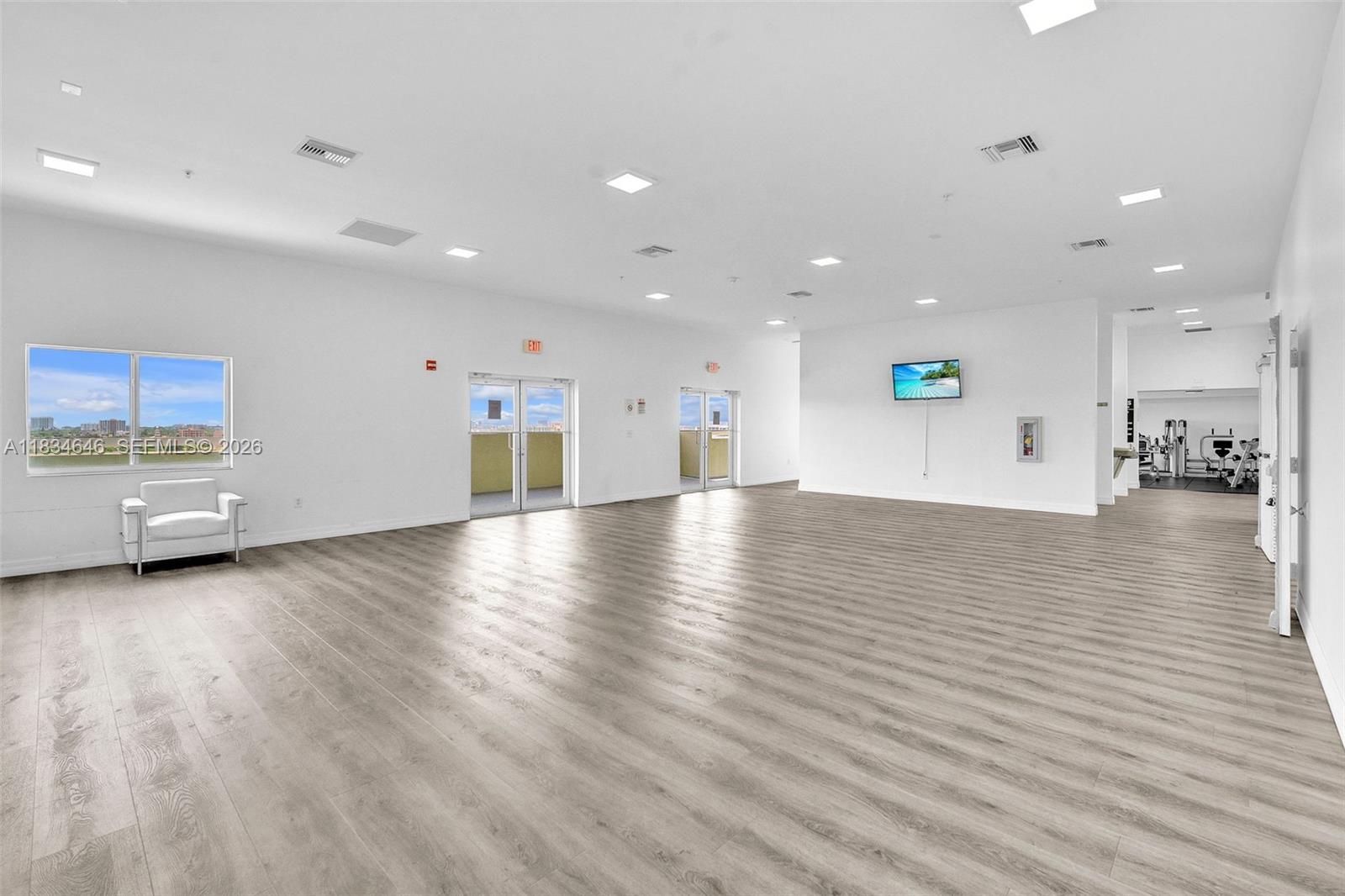 816 Northwest 11th Street, Unit 801 Miami, FL 33136 - Photo 28 of 51 a view of a kitchen with a sink and a wooden floor