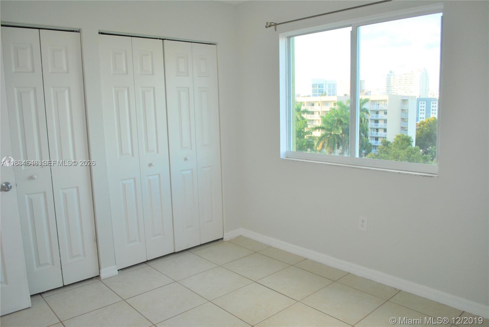 816 Northwest 11th Street, Unit 801 Miami, FL 33136 - Photo 39 of 51 a view of an empty room with a window