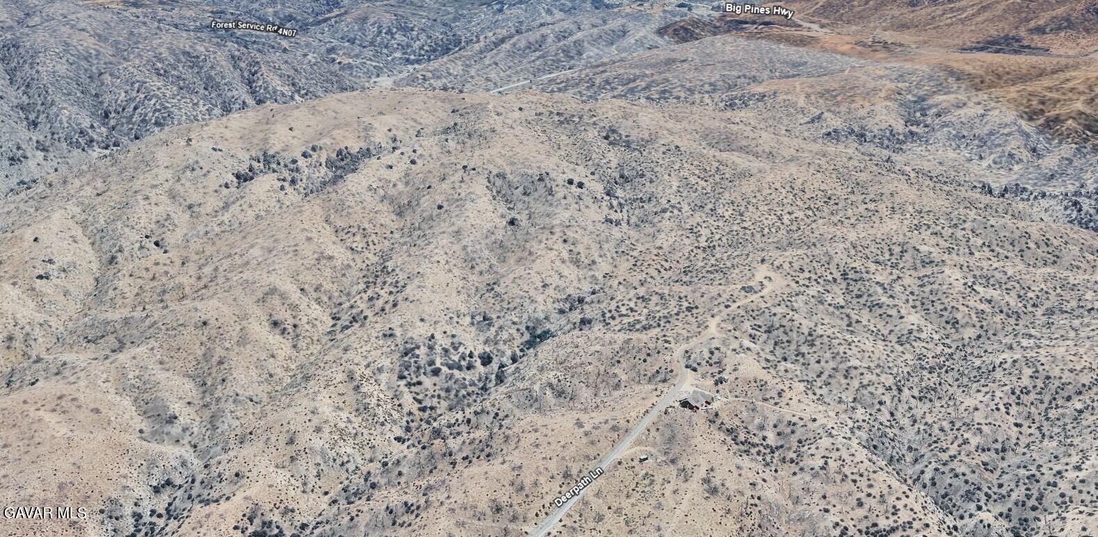 Deerpath Lane Llano, CA 93544 - Photo 2 of 6 a close up of a field