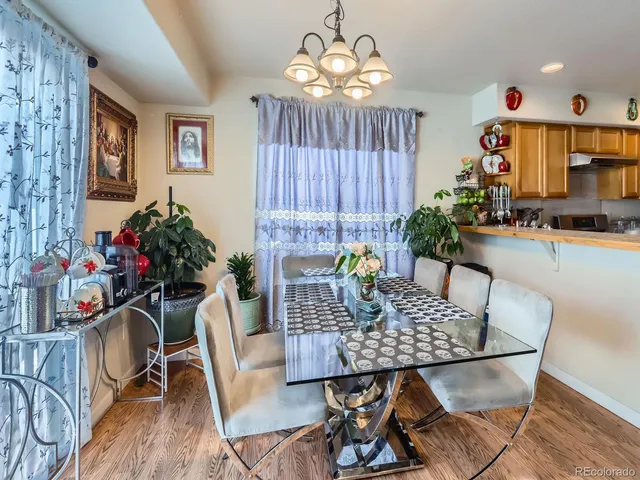 a view of a dining room with furniture window and outside view