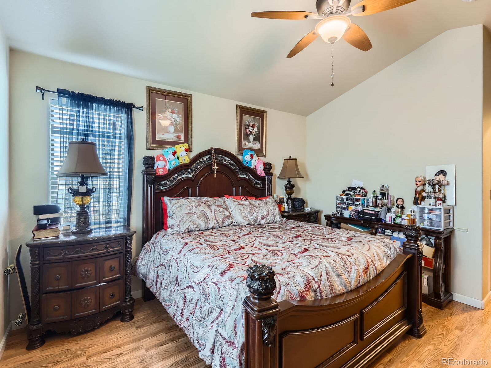 3505 Willow Drive Evans, CO 80620 - Photo 17 of 28 a bedroom with a bed and wooden floor