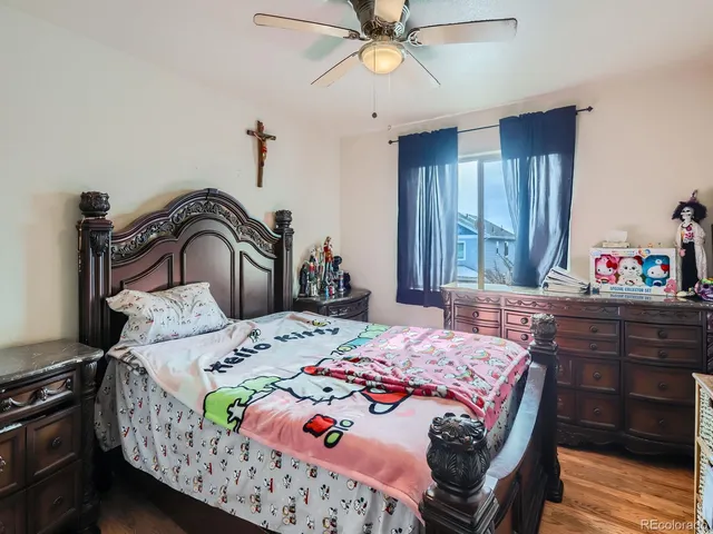 a bedroom with bed and a window