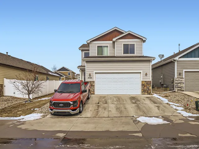 a view of a house with a parking space and parking space