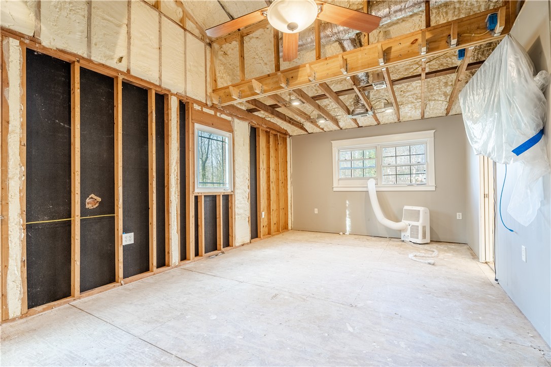 309 Woodland Way Clemson, SC 29631 - Photo 11 of 34 Large primary bedroom with vaulted ceilings and newer vinyl windows throughout.