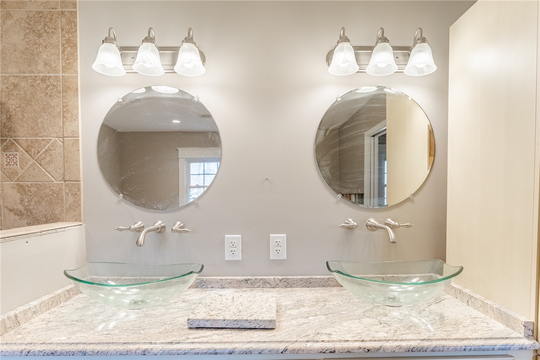 309 Woodland Way Clemson, SC 29631 - Photo 13 of 34 Two sinks and granite counters in primary bathroom.