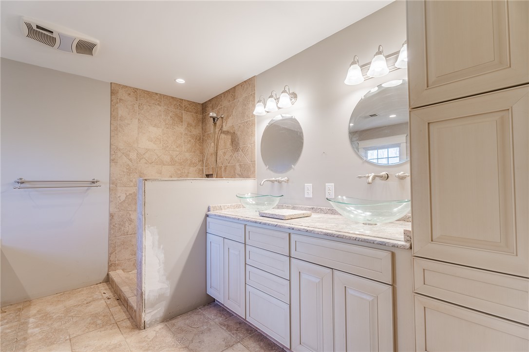 309 Woodland Way Clemson, SC 29631 - Photo 16 of 34 Walk-in shower and look at all that cabinet storage.