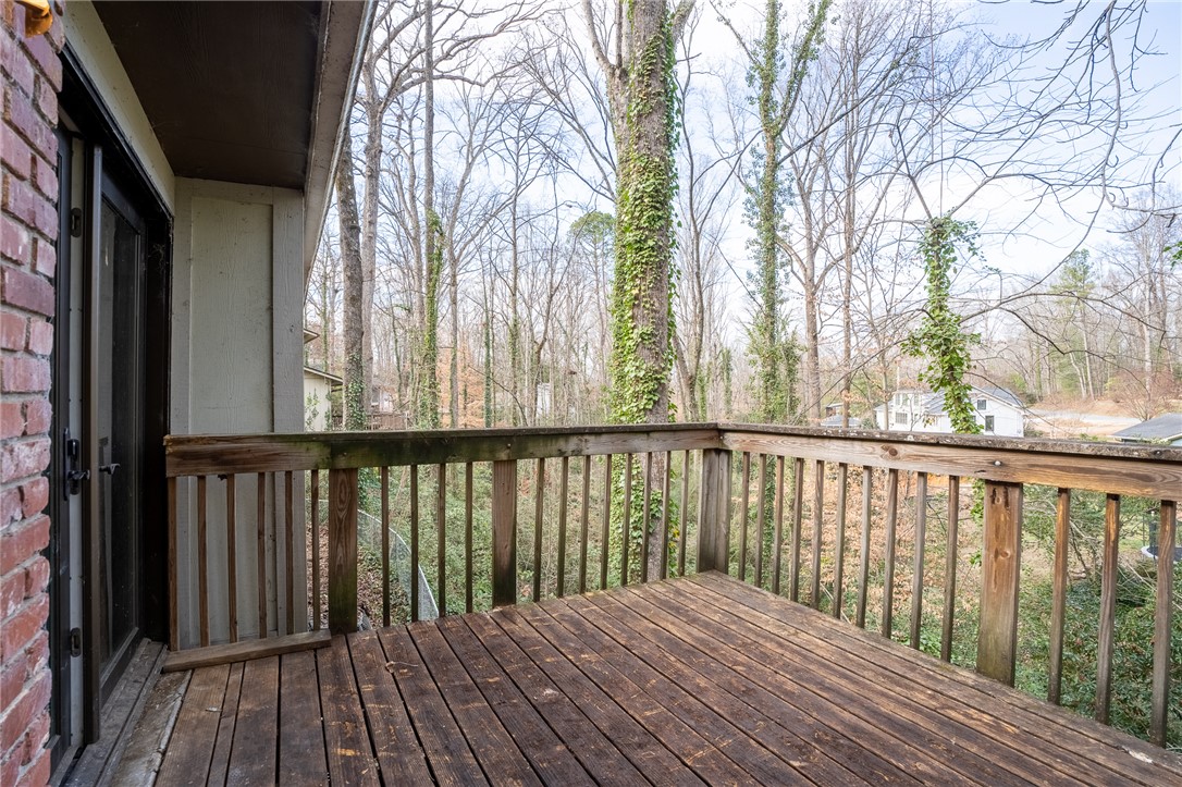 309 Woodland Way Clemson, SC 29631 - Photo 18 of 34 Deck which might need structural attention with view of large private backyard.