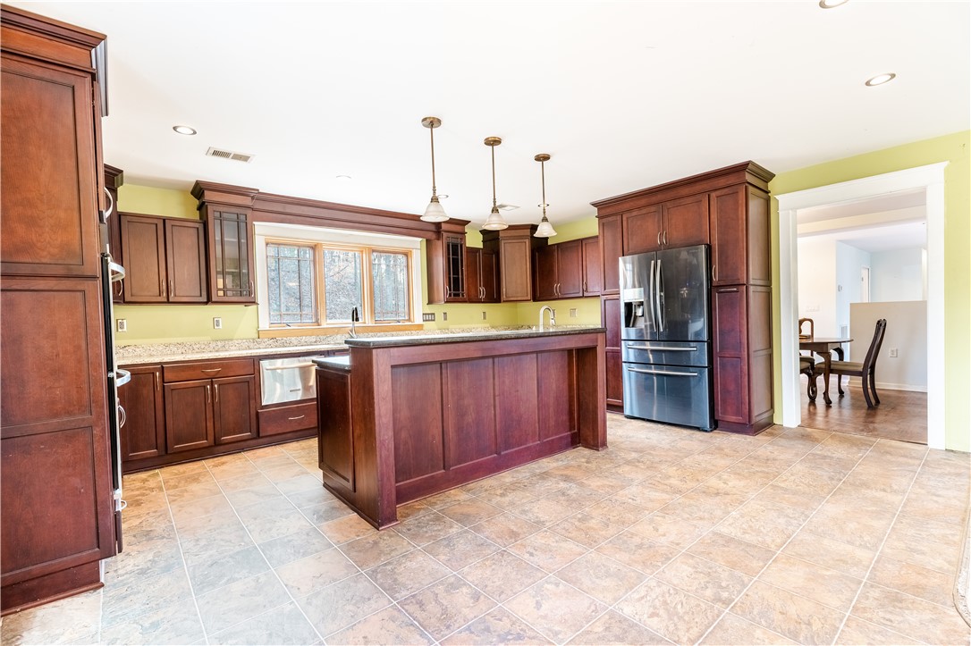309 Woodland Way Clemson, SC 29631 - Photo 2 of 34 Kitchen with granite counters and stainless appliances.