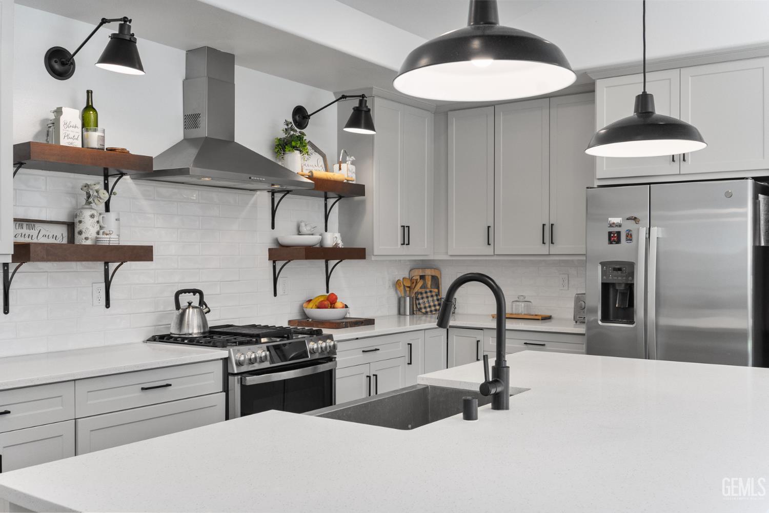 Undisclosed Address Tehachapi, CA 93561 - Photo 18 of 49 a kitchen with stainless steel appliances a sink a stove and refrigerator