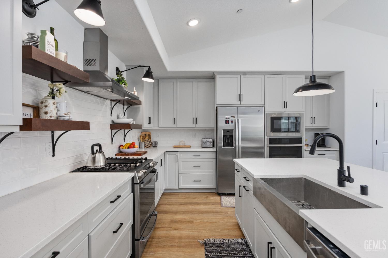 Undisclosed Address Tehachapi, CA 93561 - Photo 24 of 49 a kitchen with cabinets a sink and appliances