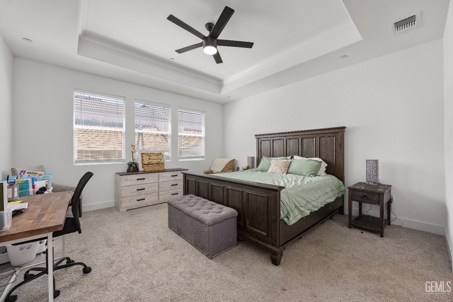 Undisclosed Address Tehachapi, CA 93561 - Photo 25 of 49 a spacious bedroom with a bed a desk and chair