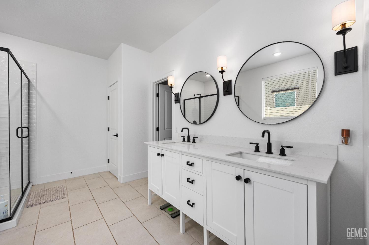Undisclosed Address Tehachapi, CA 93561 - Photo 28 of 49 a bathroom with a double vanity sink and a mirror