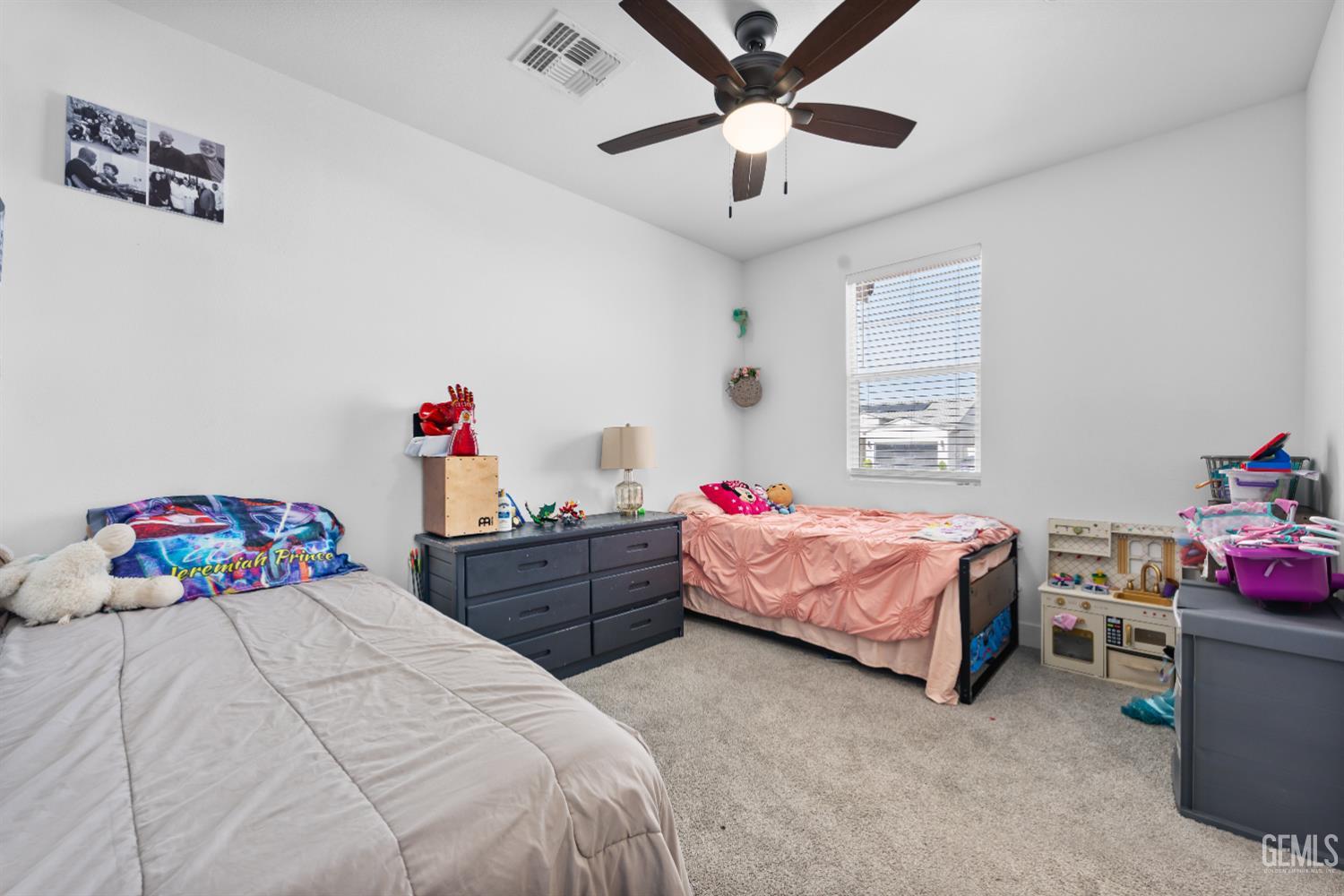 Undisclosed Address Tehachapi, CA 93561 - Photo 38 of 49 a bedroom with a bed and a chandelier