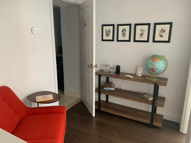 a reading room with furniture and window