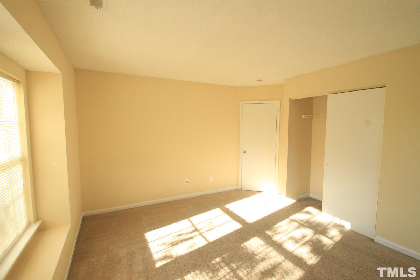 408 Pebblestone Drive Durham, NC 27703 - Photo 11 of 27 a view of a room with wooden floor and a window