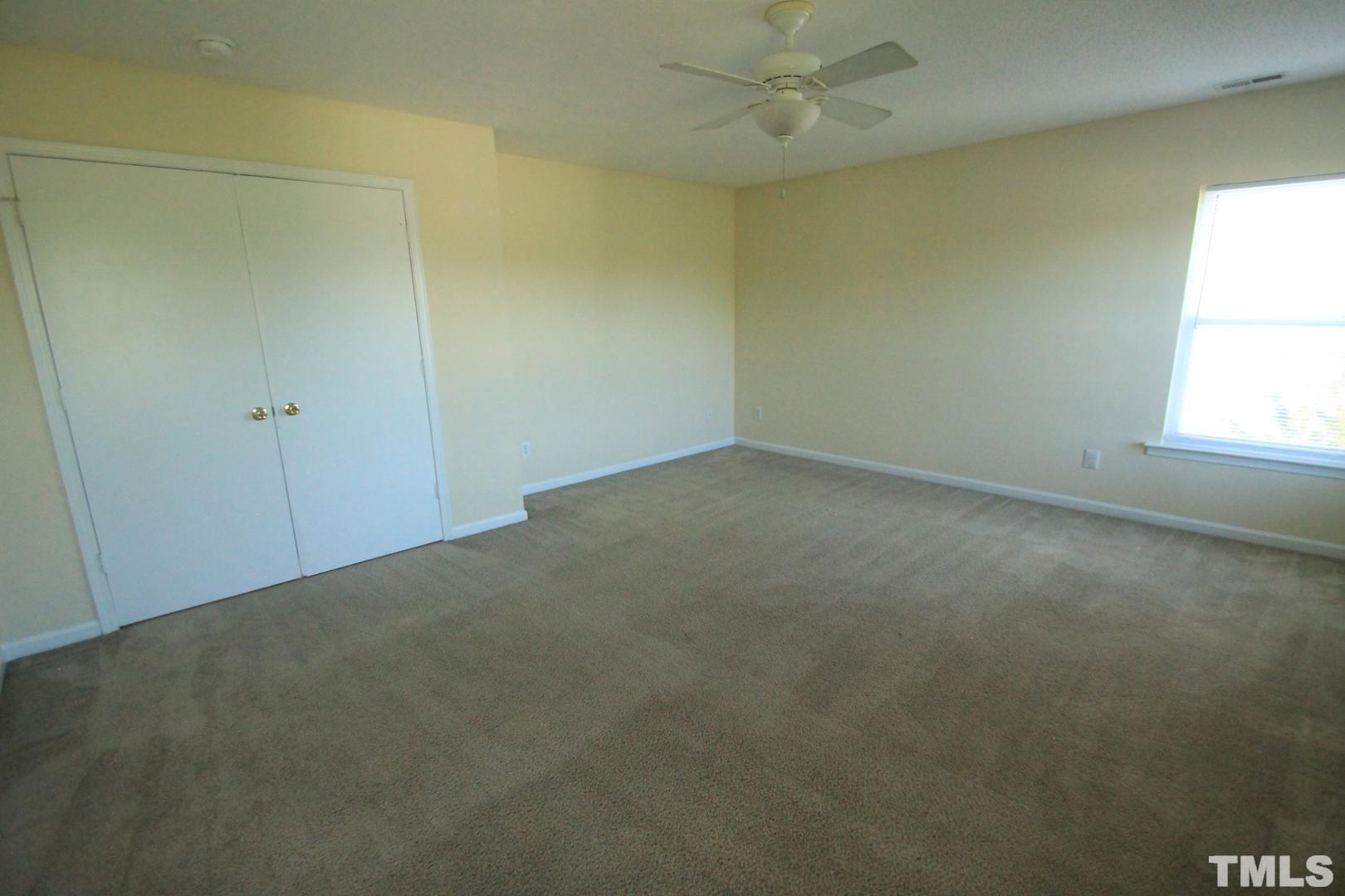 408 Pebblestone Drive Durham, NC 27703 - Photo 20 of 27 an empty room with a window