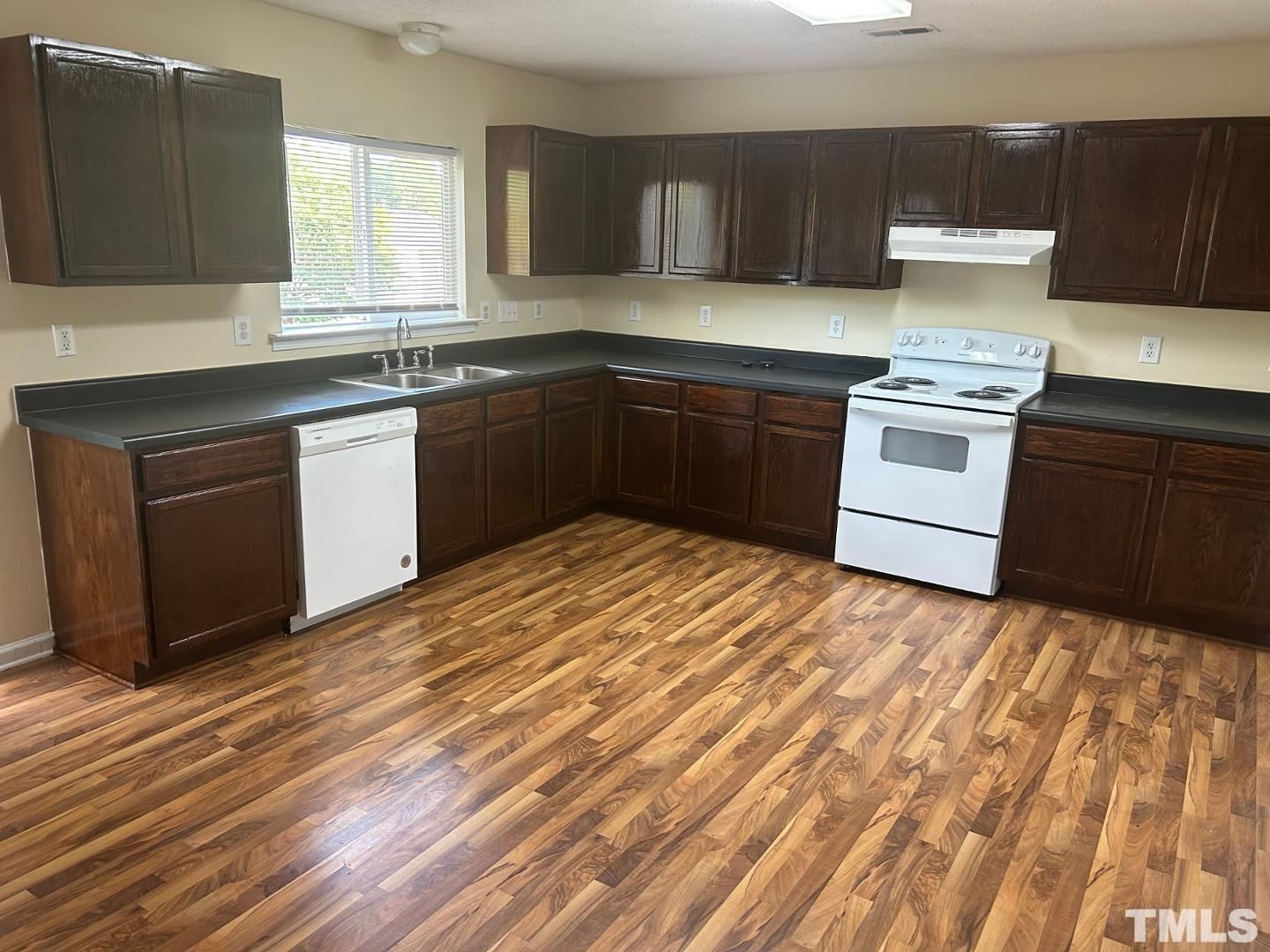 408 Pebblestone Drive Durham, NC 27703 - Photo 8 of 27 a kitchen with a sink stove and cabinets