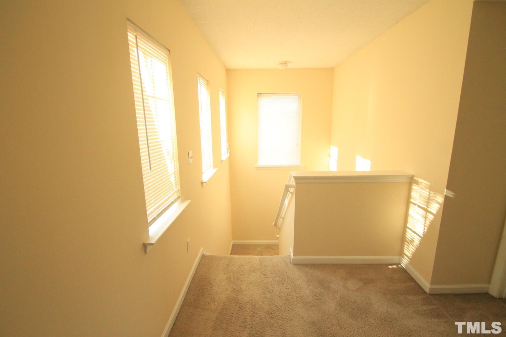 408 Pebblestone Drive Durham, NC 27703 - Photo 9 of 27 a view of an empty room and window