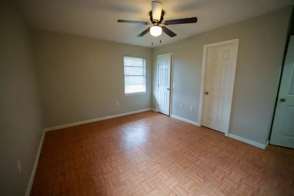 a view of room with window and ceiling fan