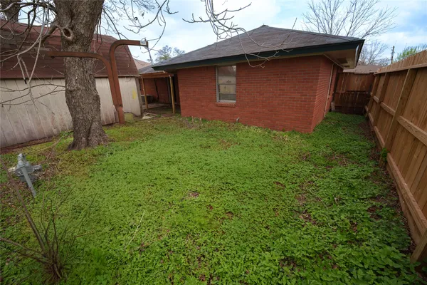 a backyard of a house with lots of green space