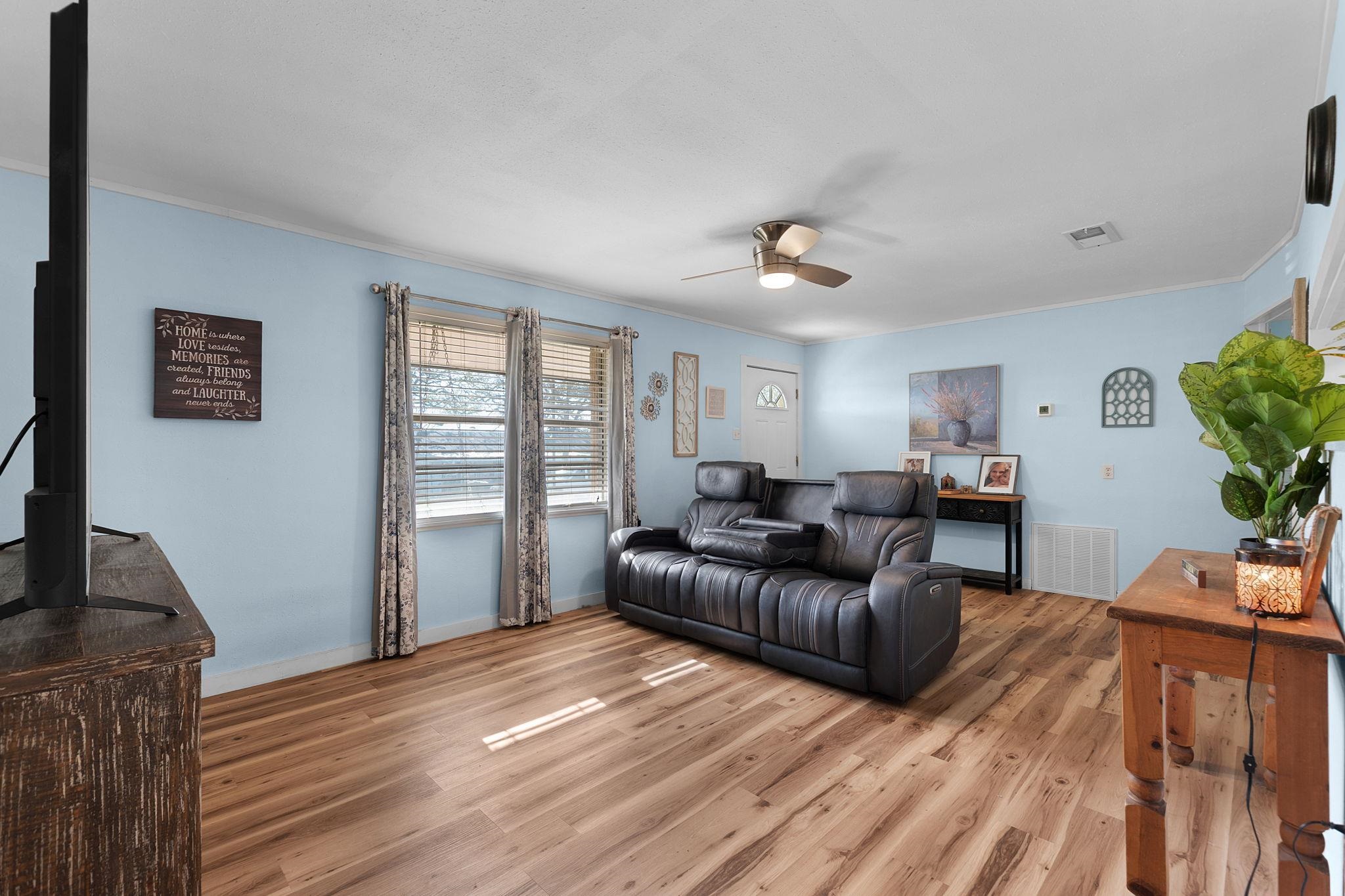 1365 Norma Tow, TX 78672 - Photo 13 of 45 a living room with furniture and a wooden floor