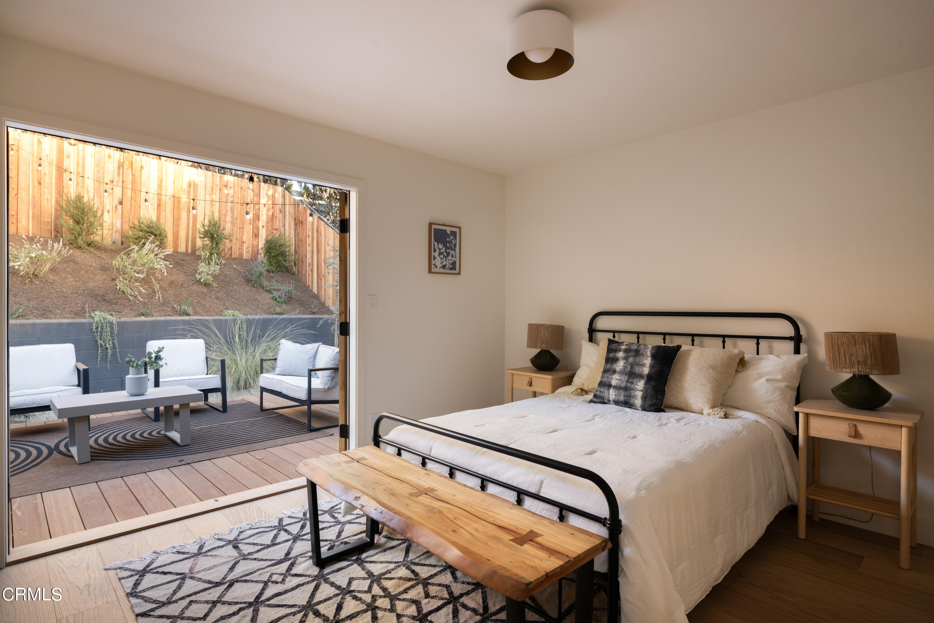 1054 Rutland Avenue Los Angeles, CA 90042 - Photo 17 of 27 a bedroom with a large bed and a large window