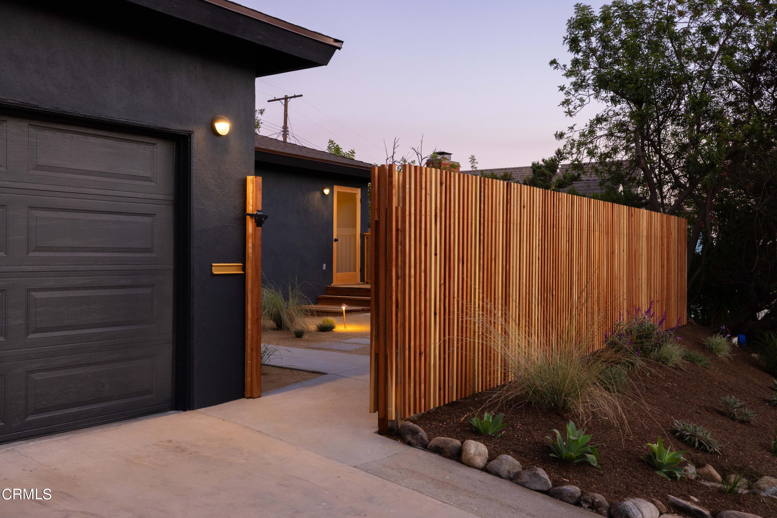 1054 Rutland Avenue Los Angeles, CA 90042 - Photo 2 of 27 a view of a porch with a wooden fence