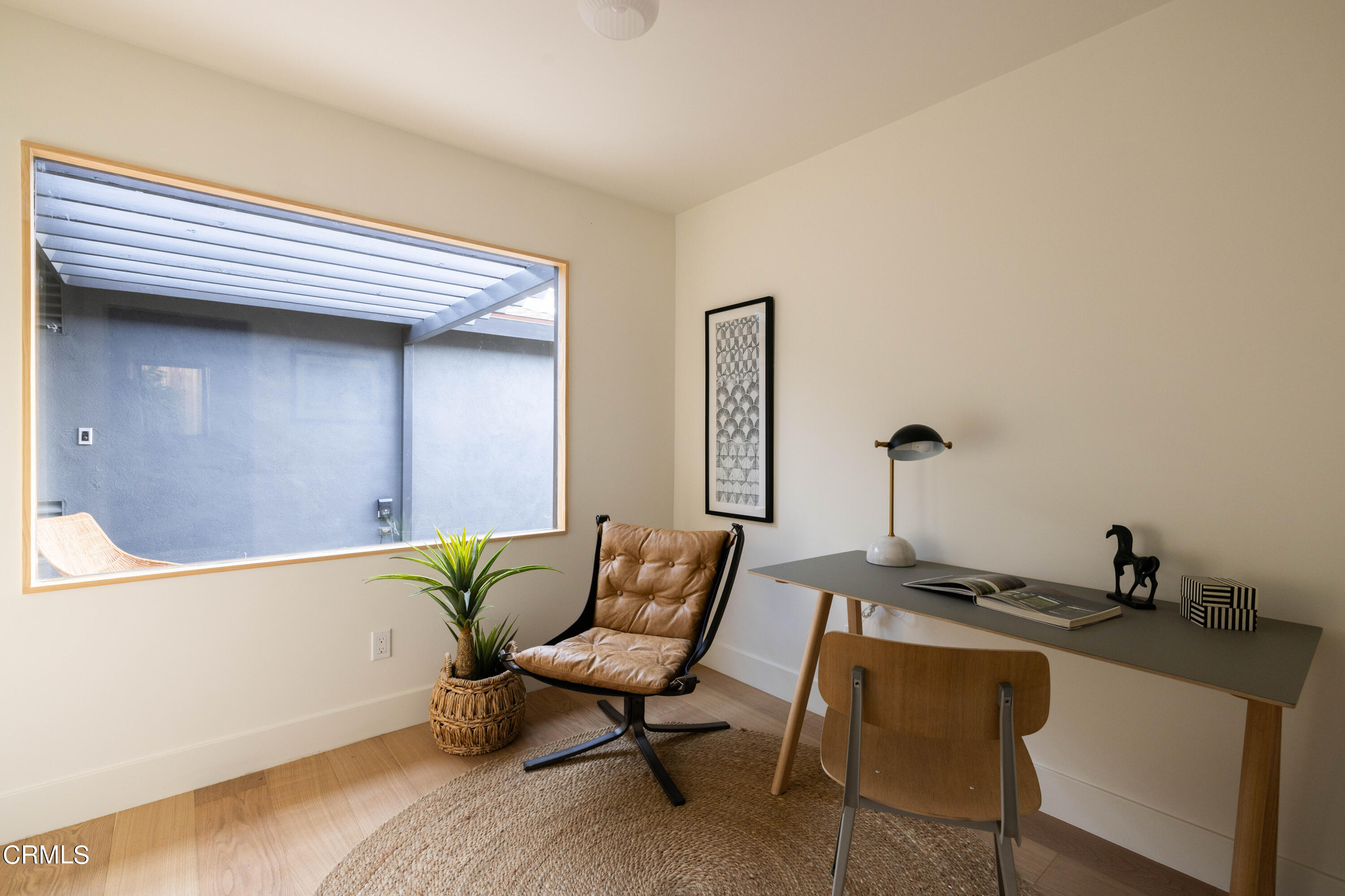 1054 Rutland Avenue Los Angeles, CA 90042 - Photo 21 of 27 a living room with furniture and a wooden floor