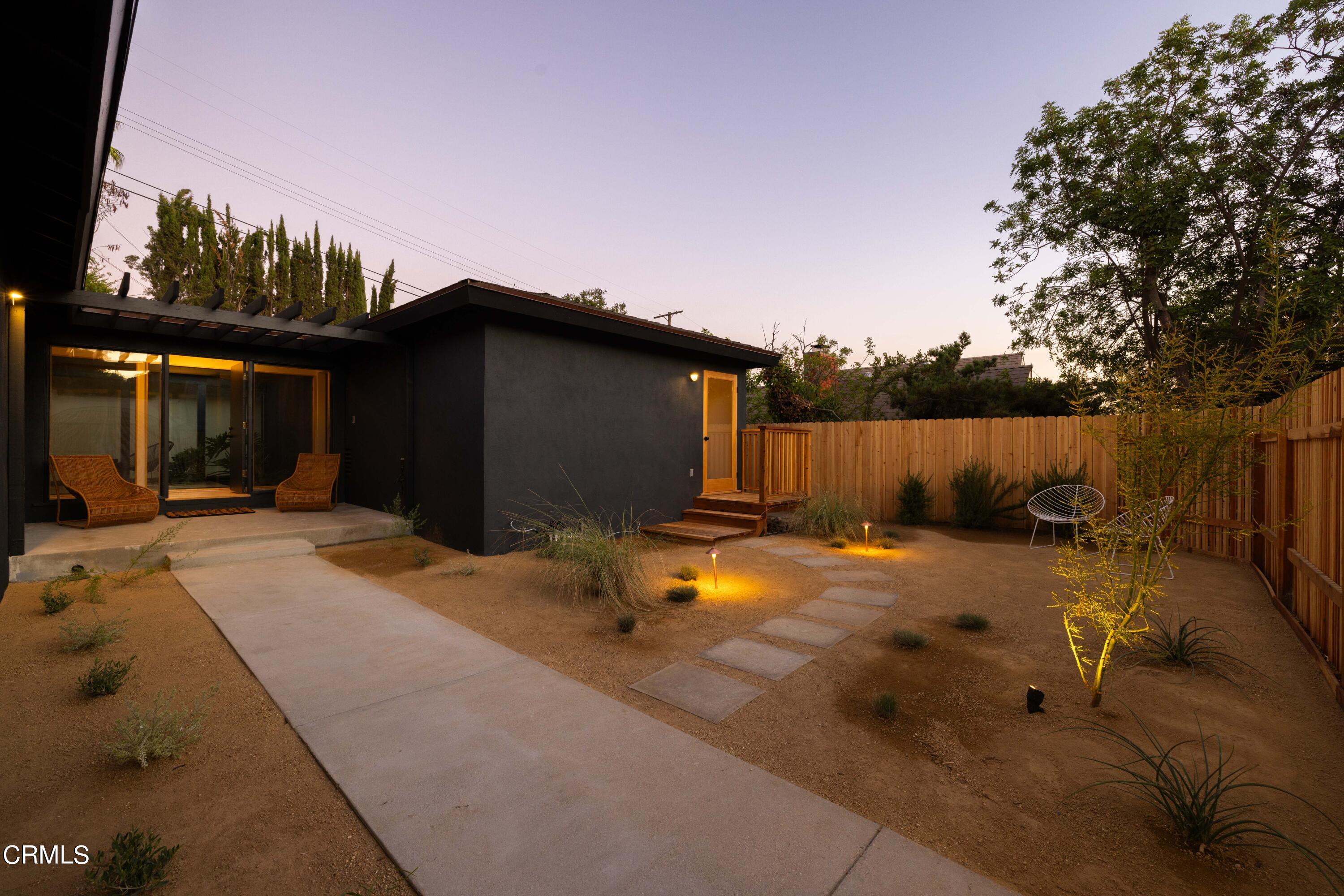1054 Rutland Avenue Los Angeles, CA 90042 - Photo 26 of 27 a backyard of a house with table and chairs