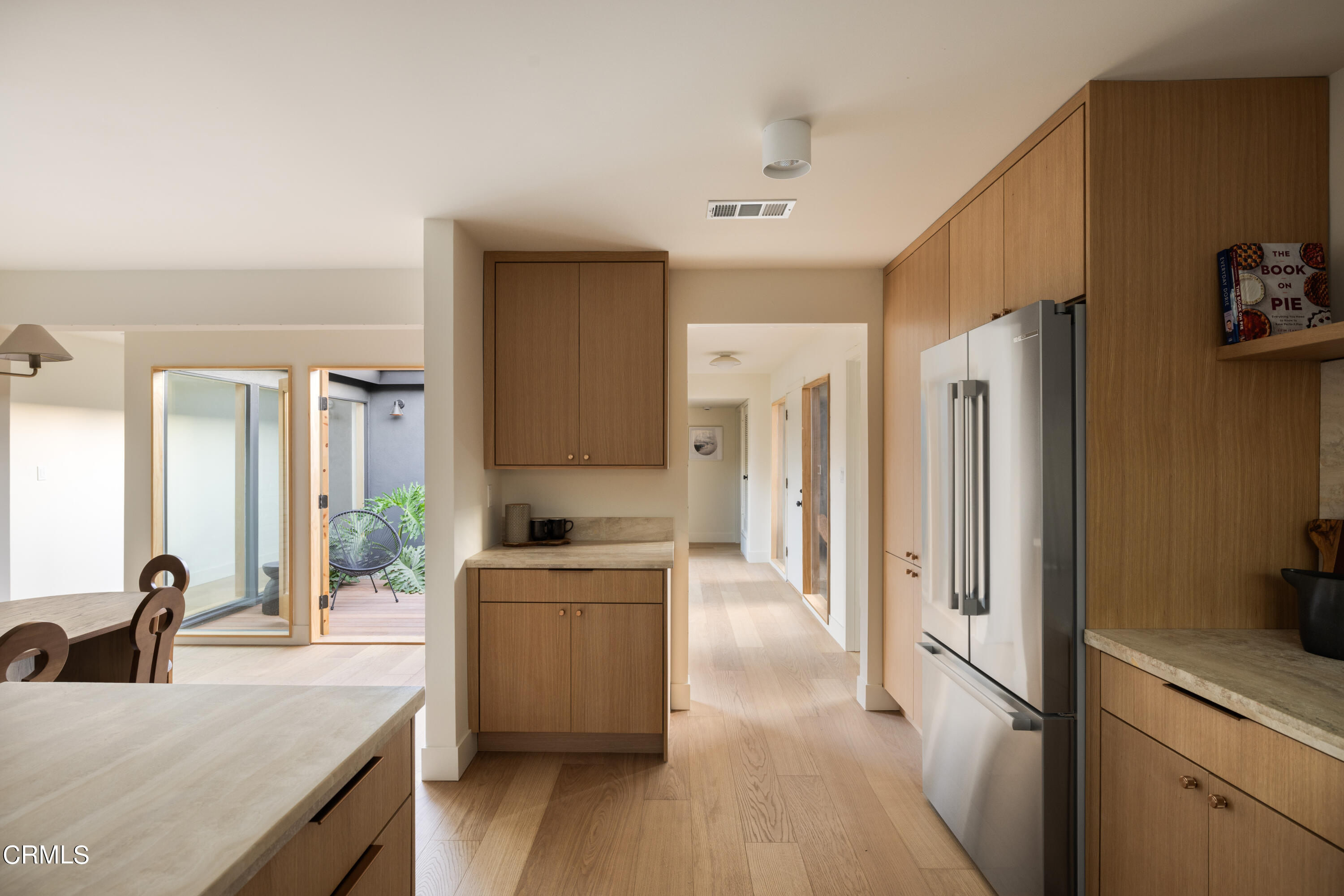 1054 Rutland Avenue Los Angeles, CA 90042 - Photo 8 of 27 a kitchen with a refrigerator a sink and a stove top oven