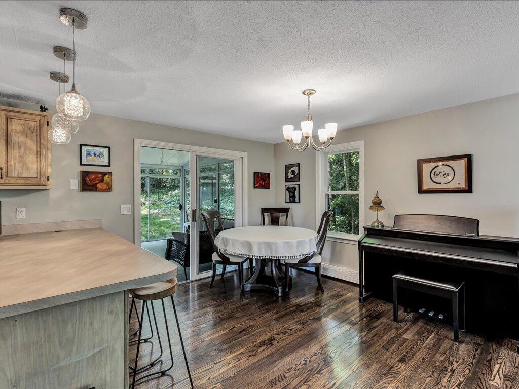 25 Moon Compass Lane Sandwich, MA 02563 - Photo 13 of 55 a view of a dining room with furniture window and wooden floor