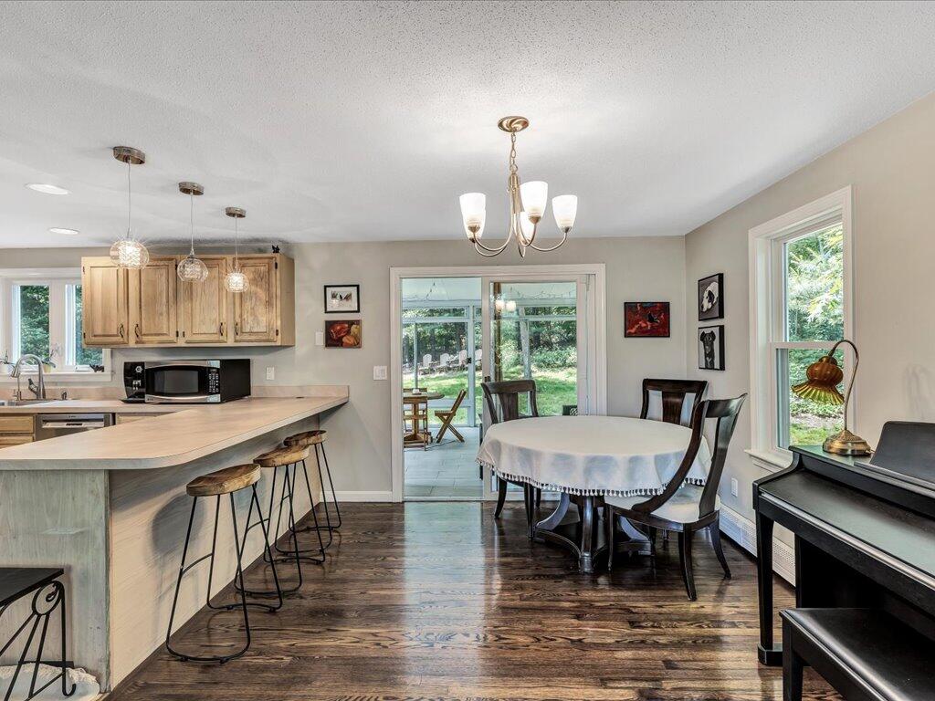 25 Moon Compass Lane Sandwich, MA 02563 - Photo 14 of 55 a view of a dining room with furniture window and wooden floor