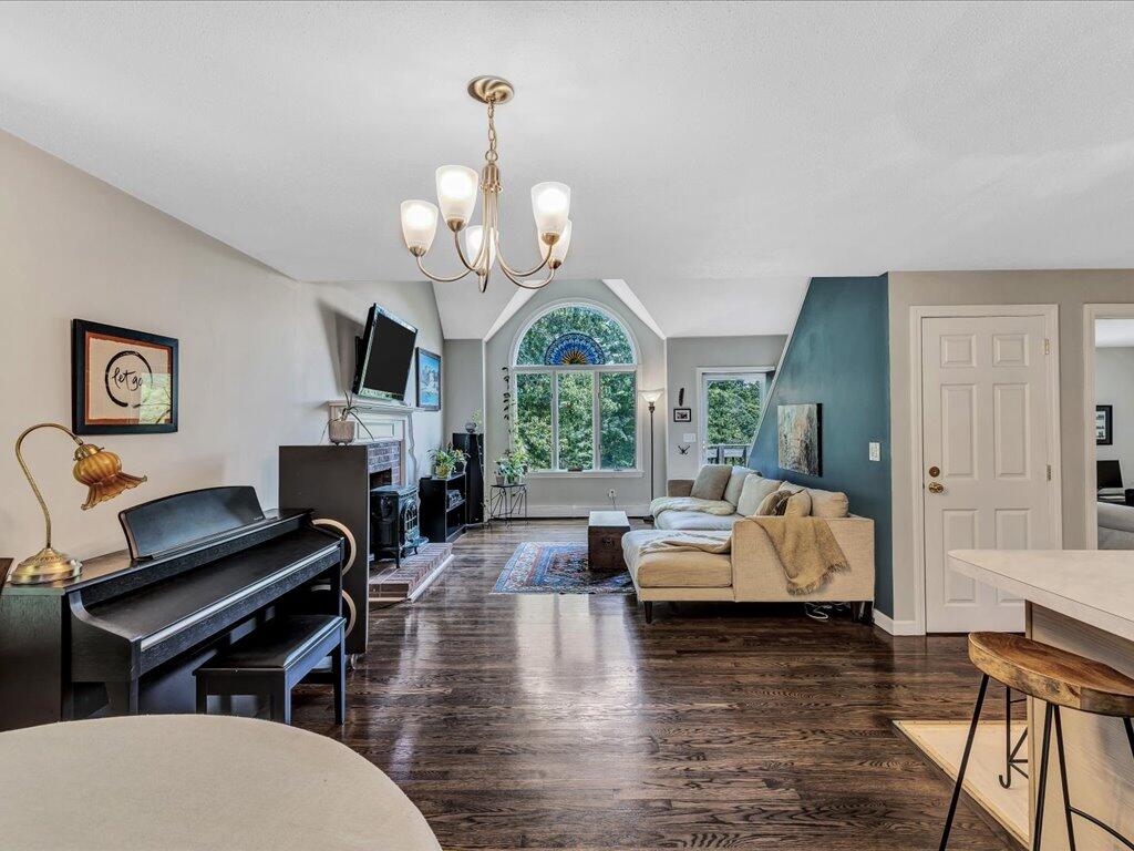 25 Moon Compass Lane Sandwich, MA 02563 - Photo 15 of 55 a living room with fireplace furniture and a wooden floor