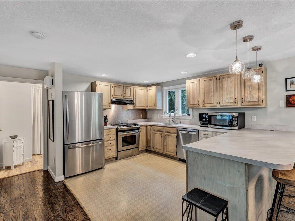 25 Moon Compass Lane Sandwich, MA 02563 - Photo 17 of 55 a kitchen with a refrigerator a stove a sink and a microwave