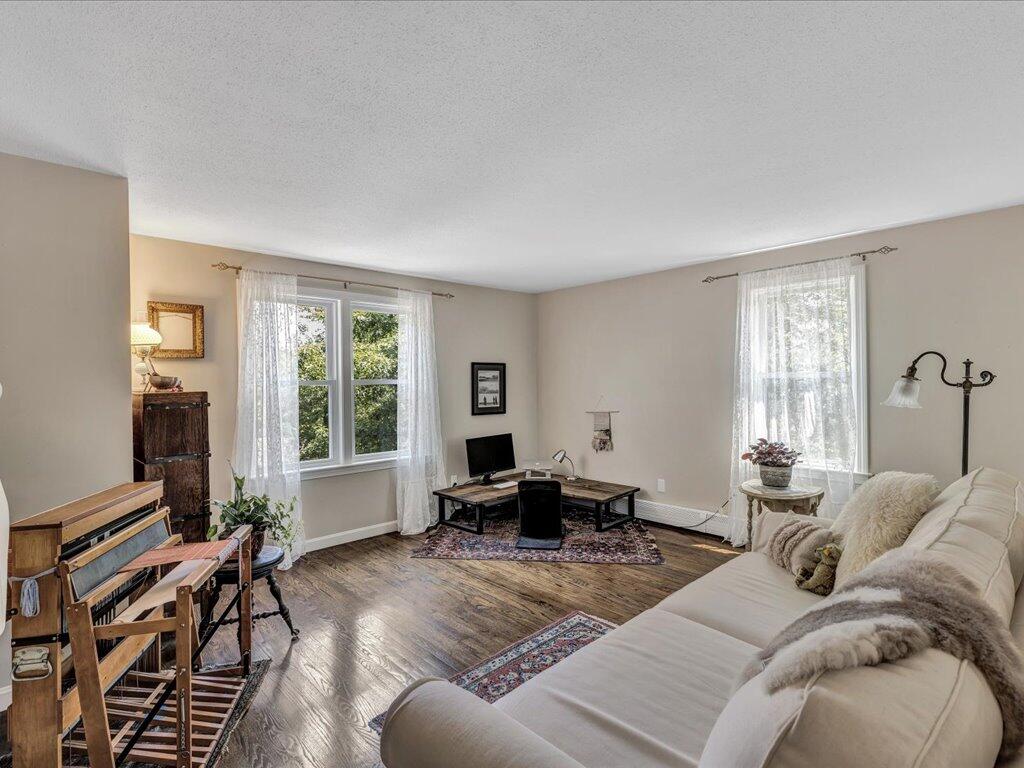 25 Moon Compass Lane Sandwich, MA 02563 - Photo 22 of 55 a living room with furniture and a window