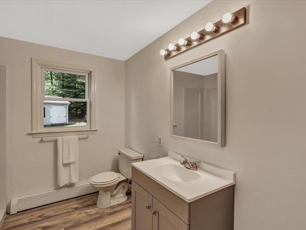 25 Moon Compass Lane Sandwich, MA 02563 - Photo 26 of 55 a bathroom with a toilet sink and mirror